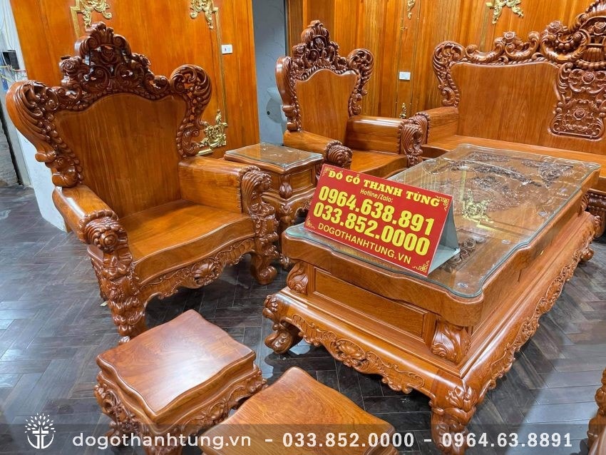 Ván ghế dày dặn sử dụng nguyên tấm gỗ hương đá 10 phân với hoa vân độc đáo, tay ghế cuộn tròn chà bóng mịn không chắp ghép